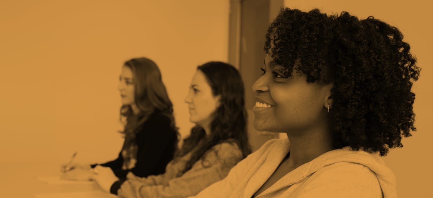 close up of smiling student in classroom